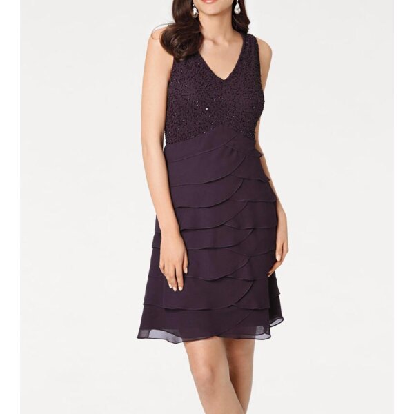 Dress with flounces, plume